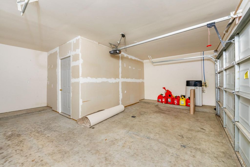 4908 Summer Rain Dr, Conroe, TX 77303 Interior of an unfinished two-car garage